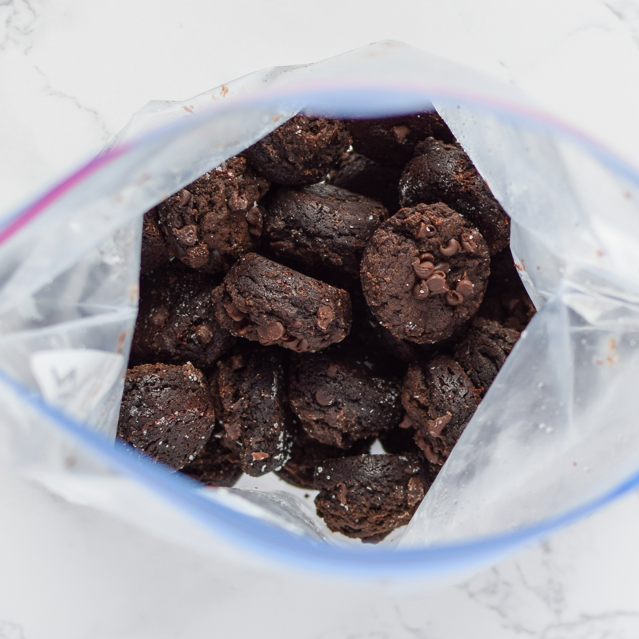 A Ziploc bag full of freezer friendly sweet potato brownie bites.