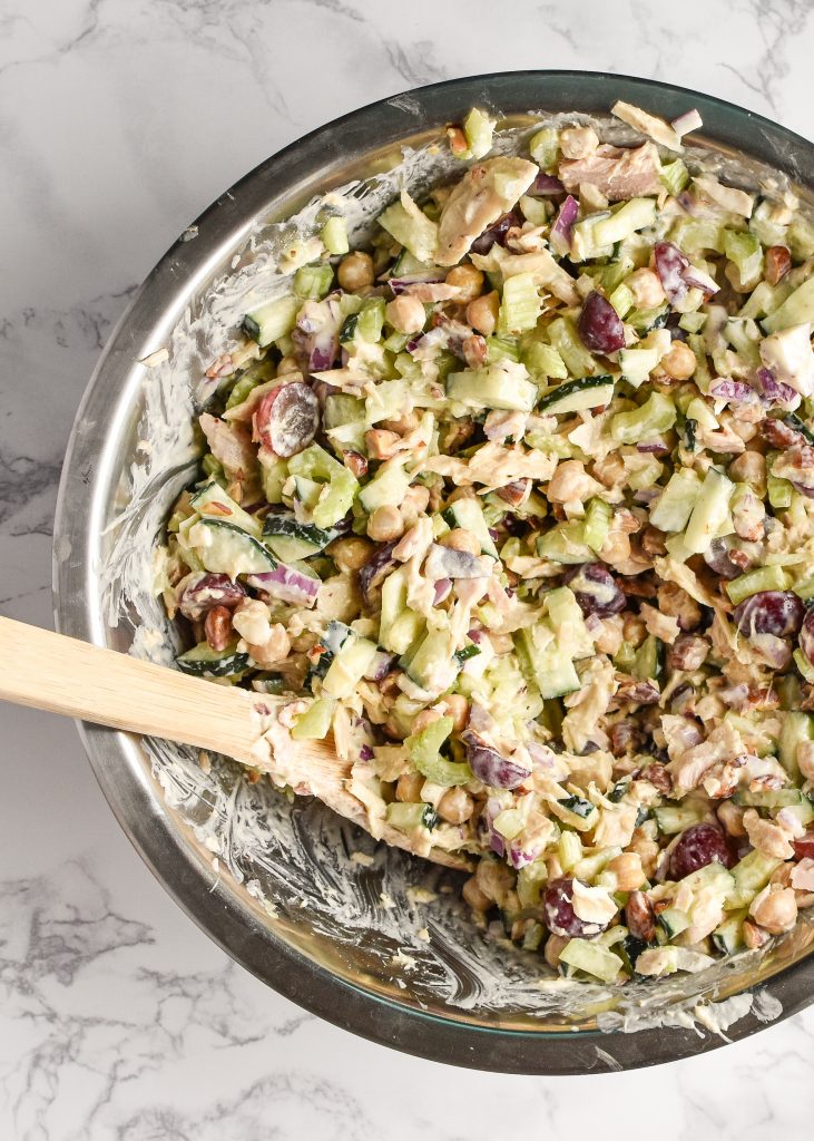 Veggie-Packed Greek Yogurt Tuna Salad (No-Mayo!) in a metal mixing bowl with a wooden spoon.