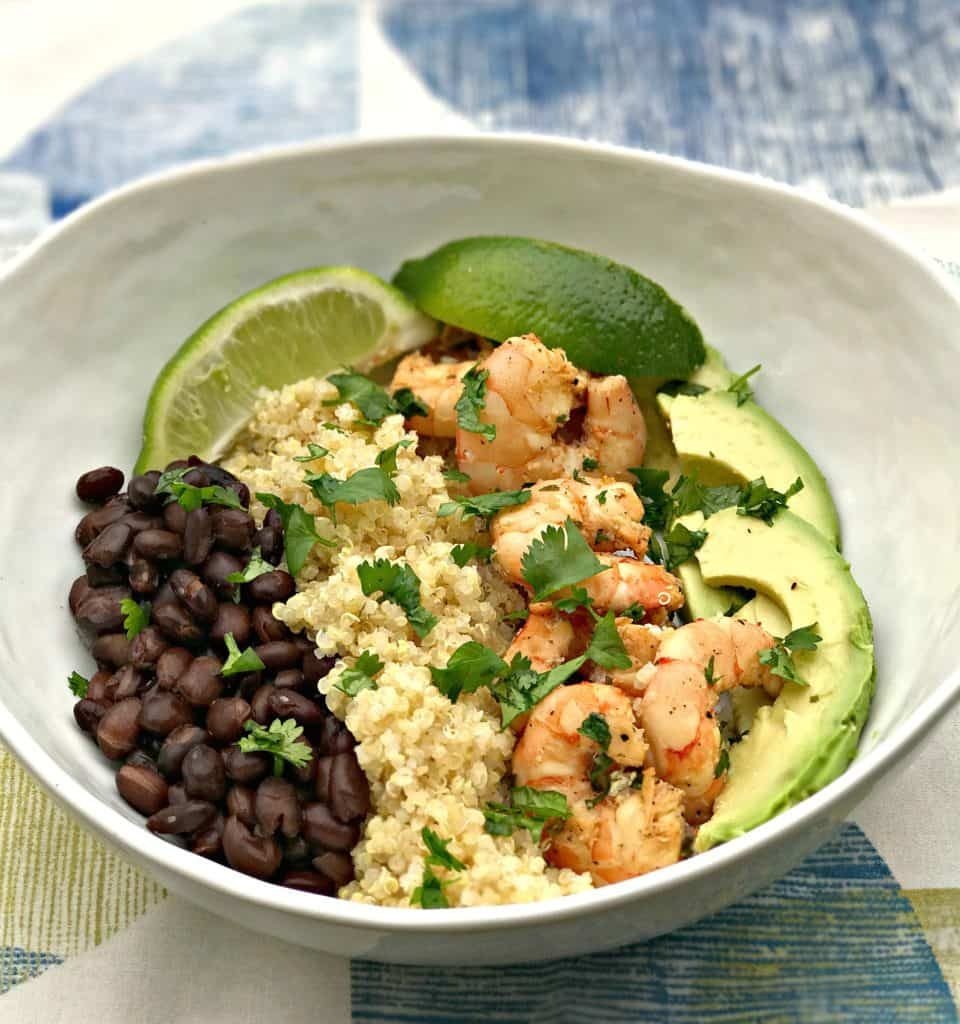 a bowl with black beans, chicken, avocado and quinoa.