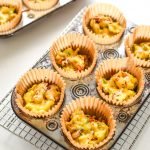 These Southwest Muffin Tin Hash Brown Egg Cups are perfect for your breakfast meal prep! Southwest hash browns with veggies, cheese, scrambled eggs, and a tiny dose of chipotle Tabasco! - ProjectMealPlan.com