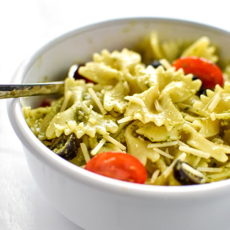 A delicious bowl of Incredibly Easy Pesto Pasta Salad - just 6 simple ingredients for the best make-ahead side dish! - ProjectMealPlan.com
