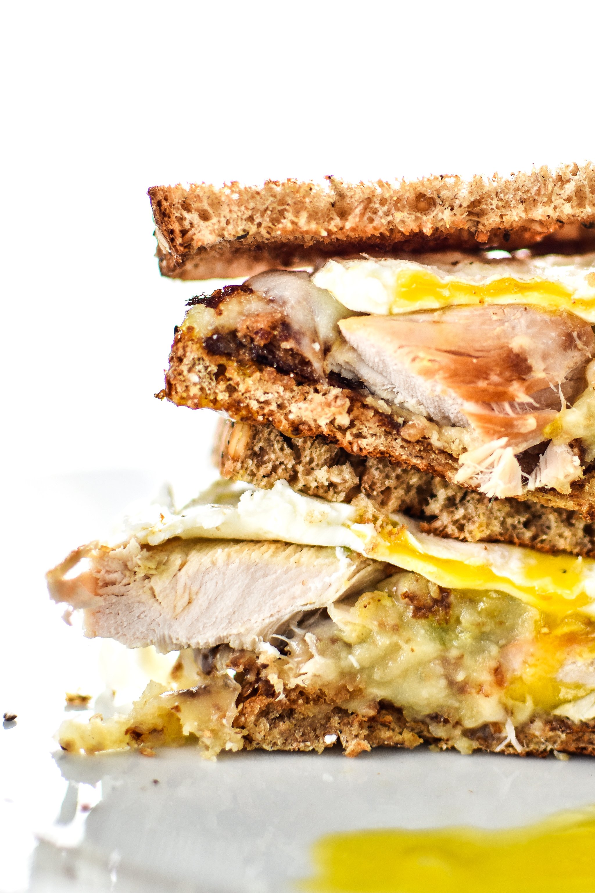 Ultimate Leftover Turkey Breakfast Sandwich - The best use of your holiday leftovers! Stuffing, mashed potatoes, turkey, topped with a fried egg! Take a bite! - ProjectMealPlan.com