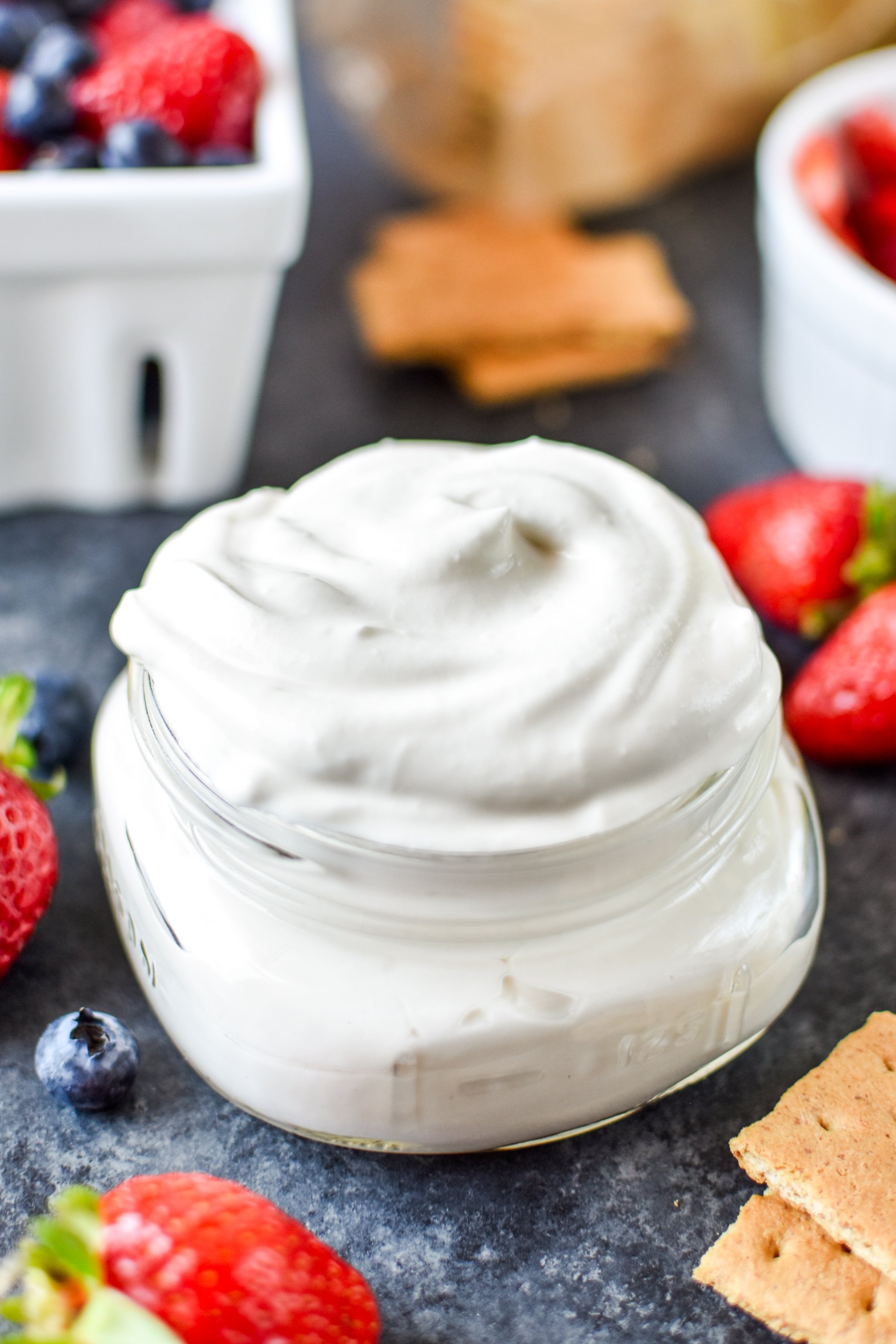 Learn how to make whipped greek yogurt like in this jar! Whipped and airy, perfect for dipping or eating with a spoon!