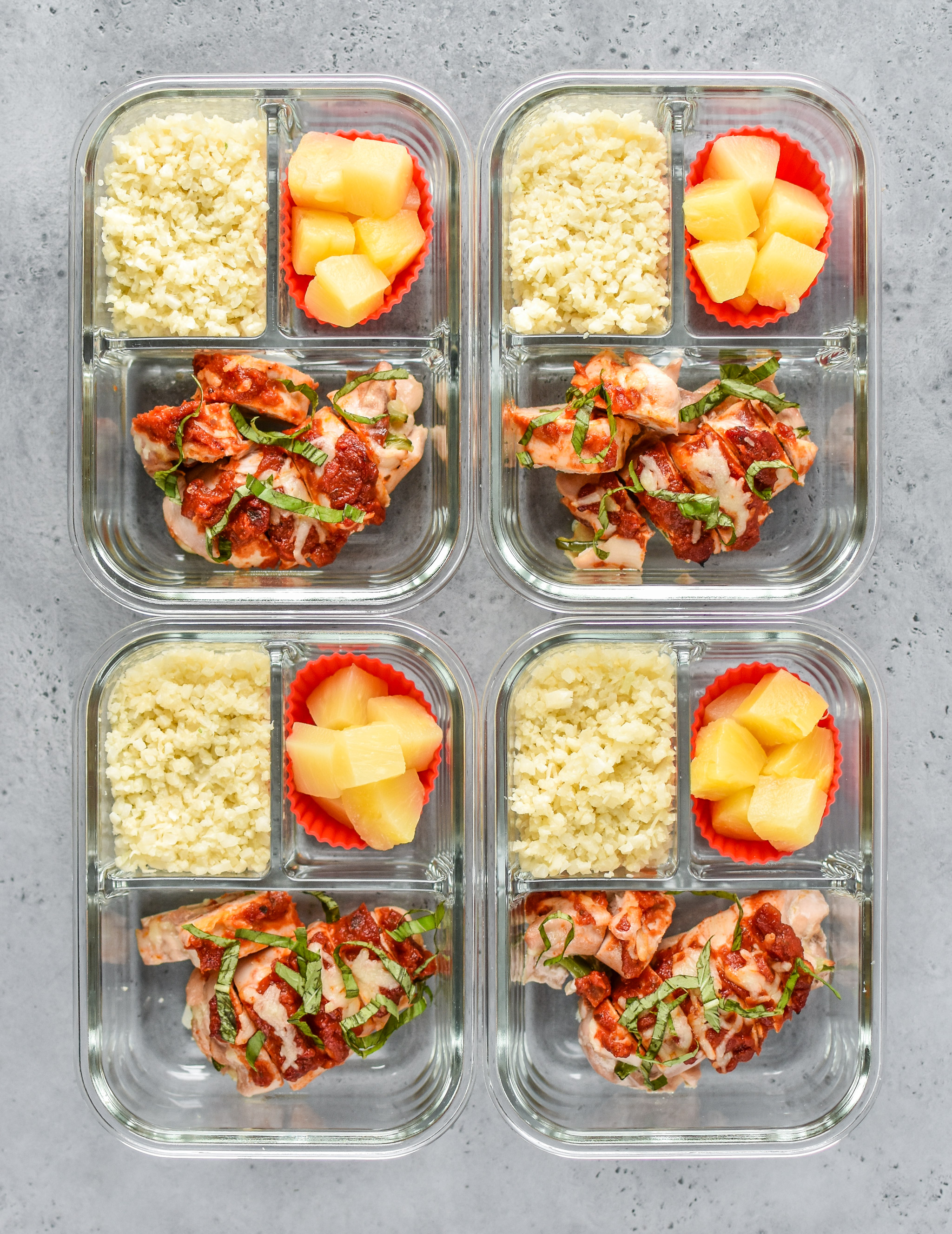 Pizza Chicken Roll Ups Meal Prep portioned out into containers and viewed from above 