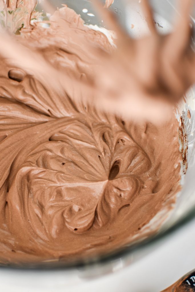 peppermint chocolate whipped greek yogurt in the bowl of a stand mixer.