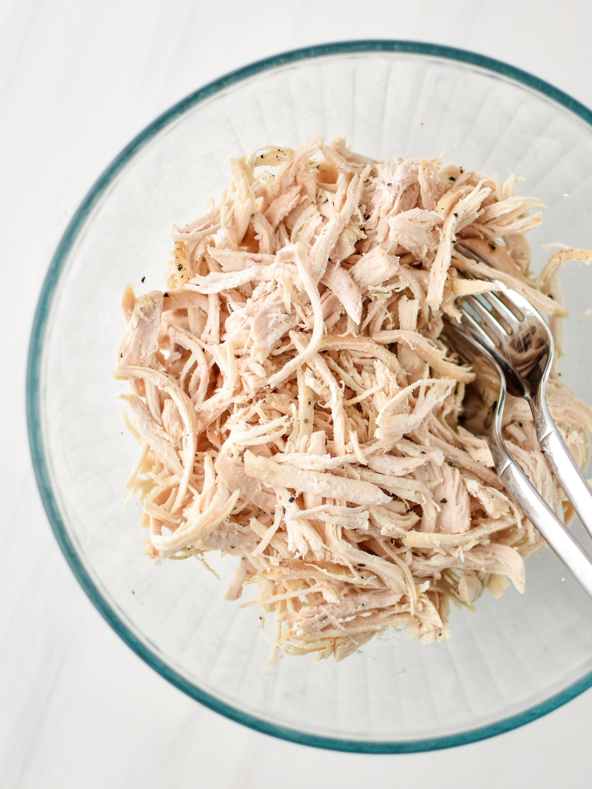 Shredded chicken in a bowl for the Easy Buffalo Chicken Salad