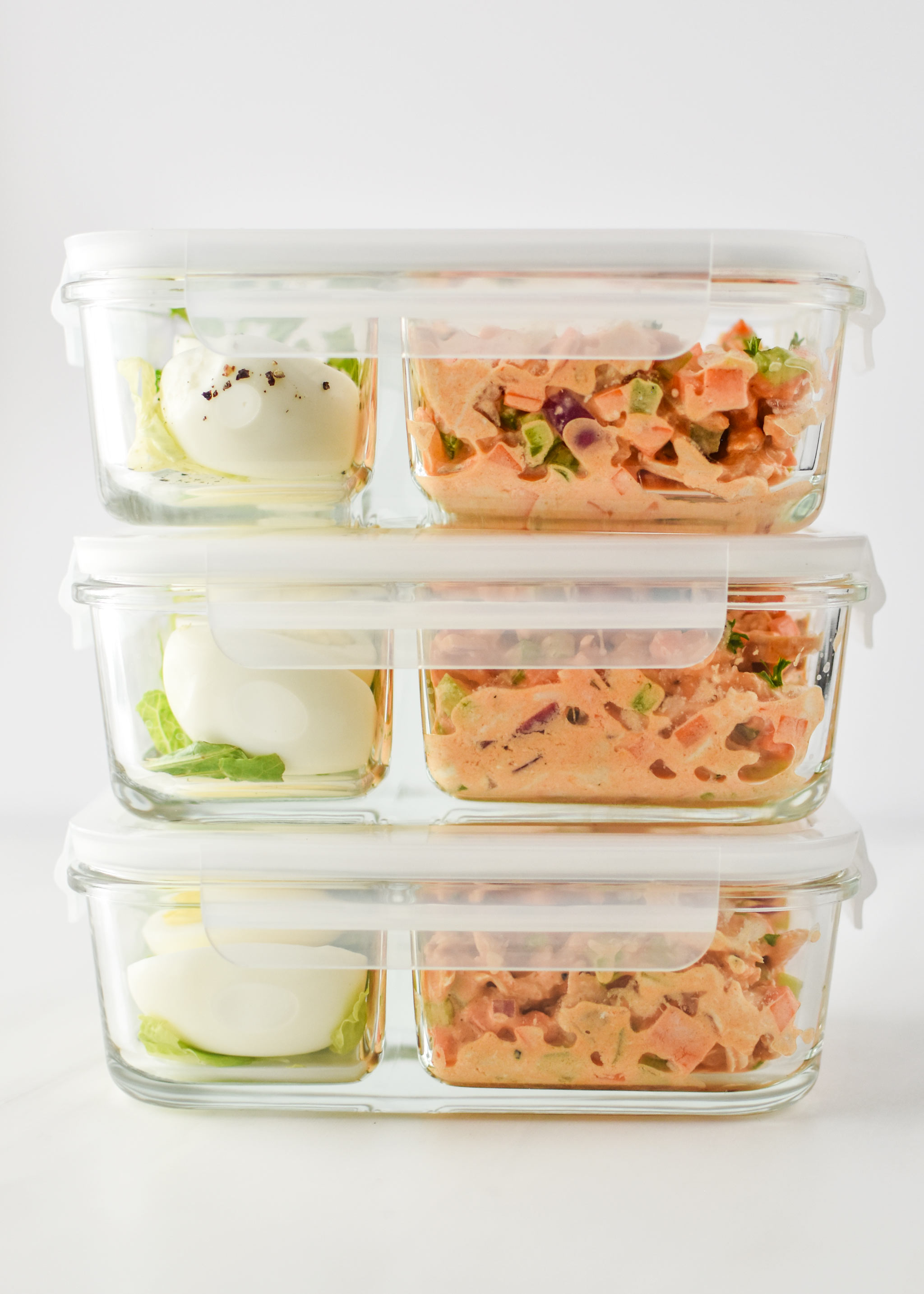 Easy buffalo chicken salad meal prepped into 3 containers