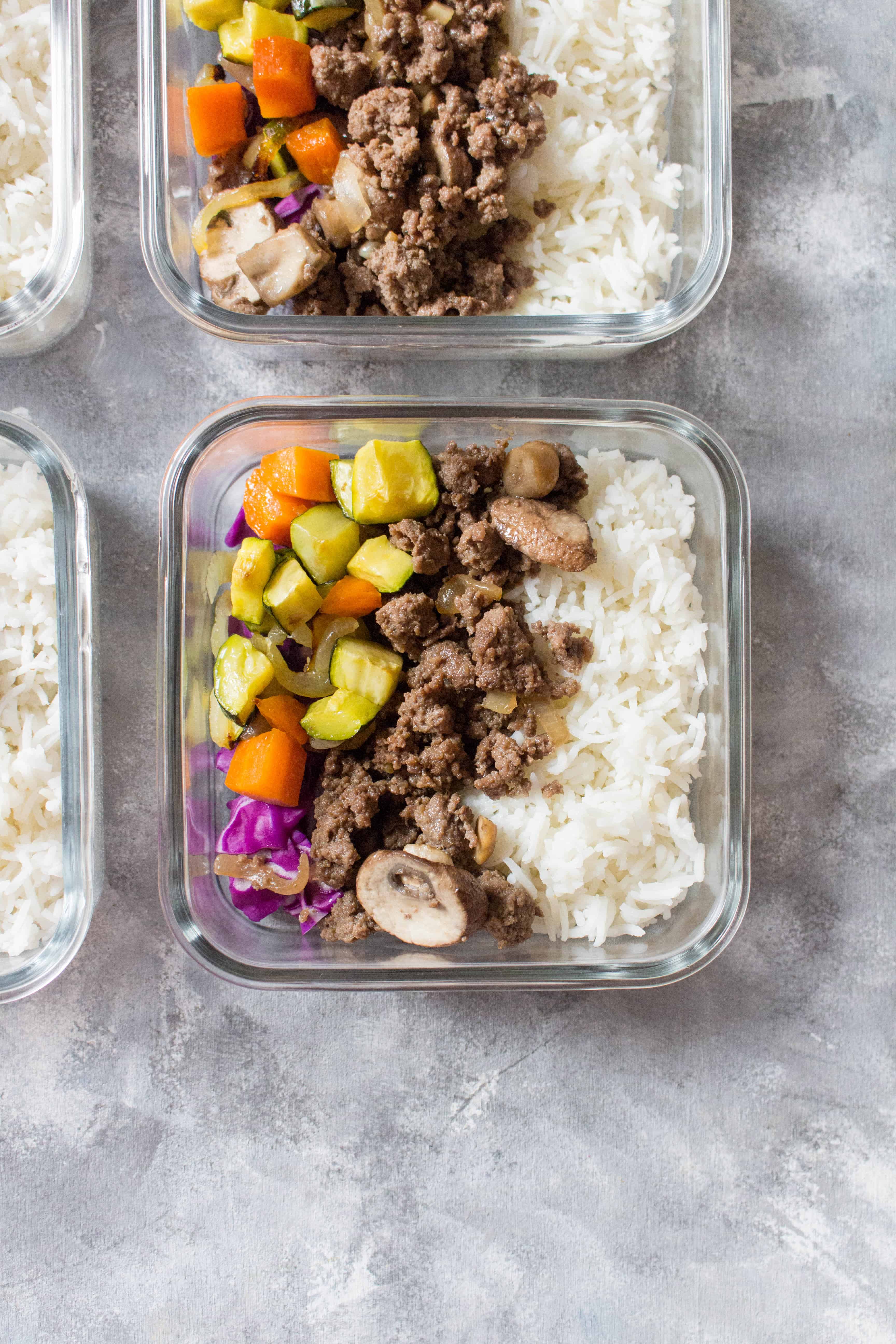 Korean beef bowls with rice and veggies portioned into meal prep containers for lunch. Meal Prep Lunch Recipes