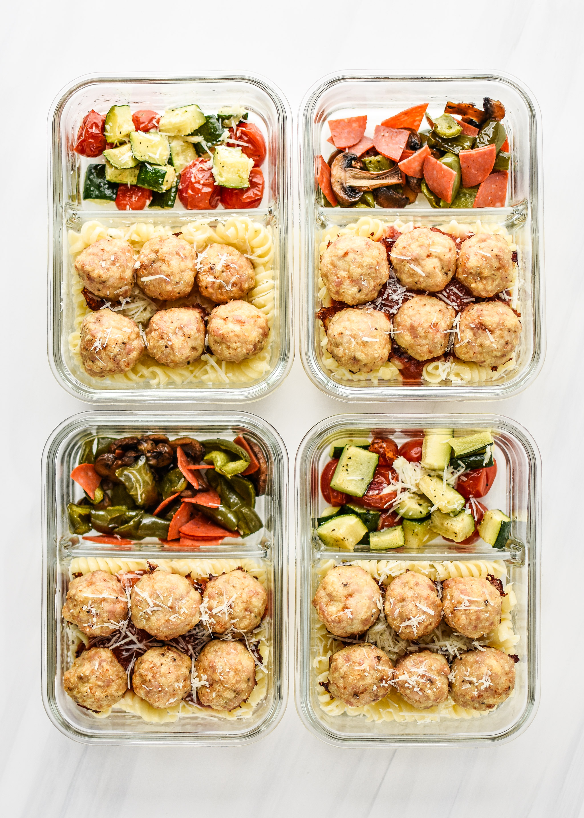 Chicken Meatballs recipe two ways portioned into lunch meal prep containers.