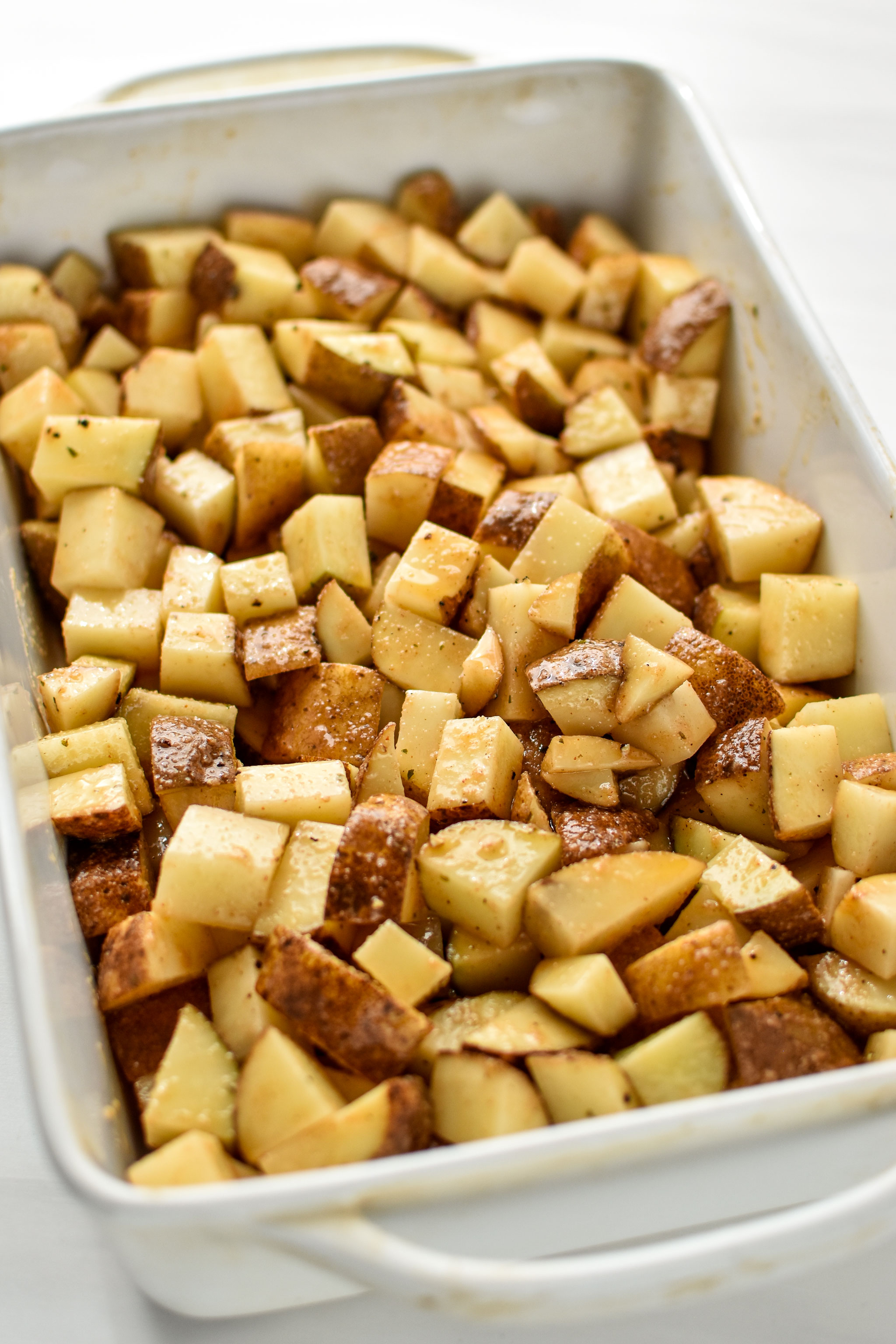 potatoes in the casserole dish for the chicken bacon ranch potato bake