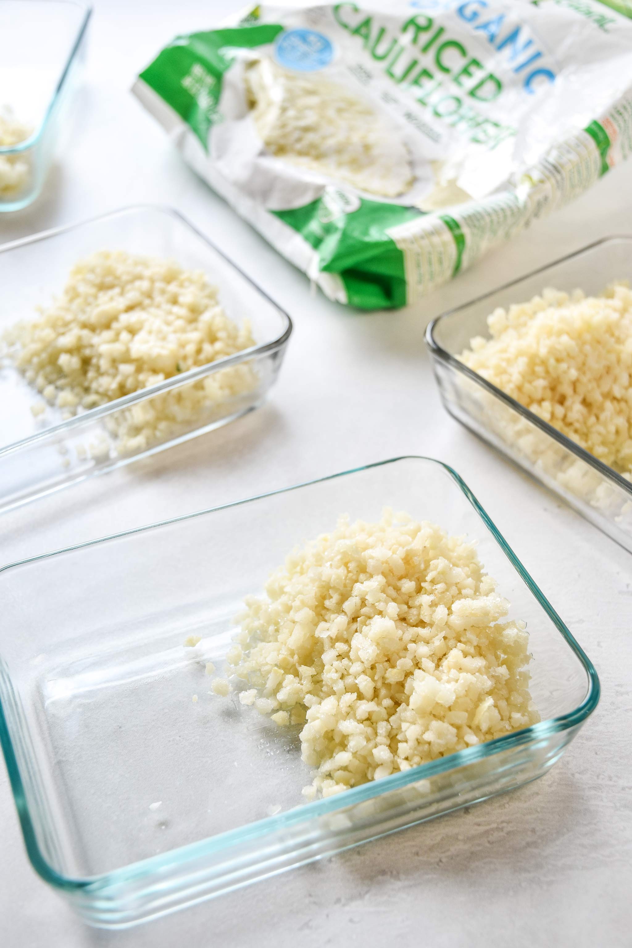 meal prep bowls with cauliflower rice portioned