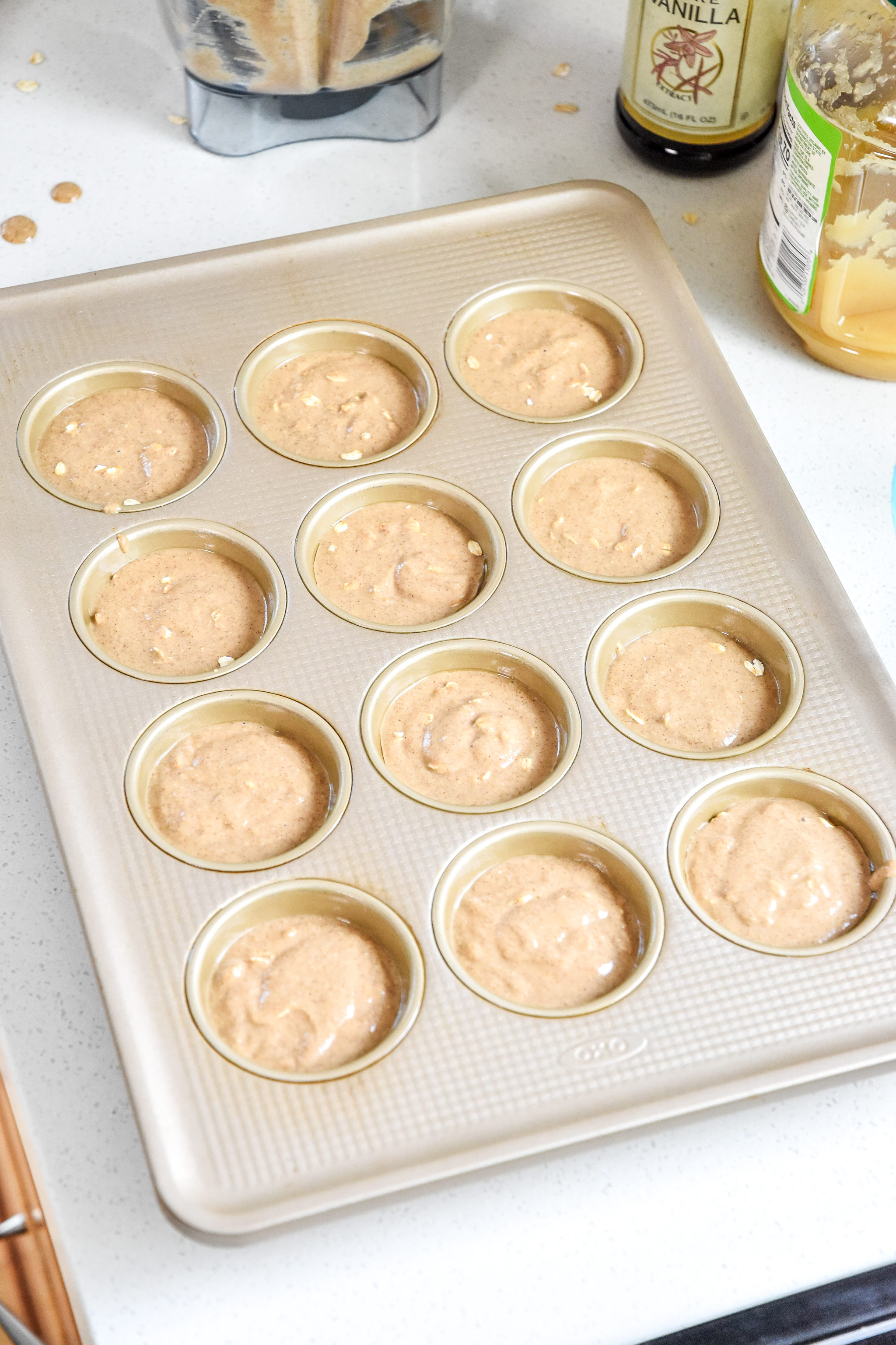batter divided among the 12 count muffin pan