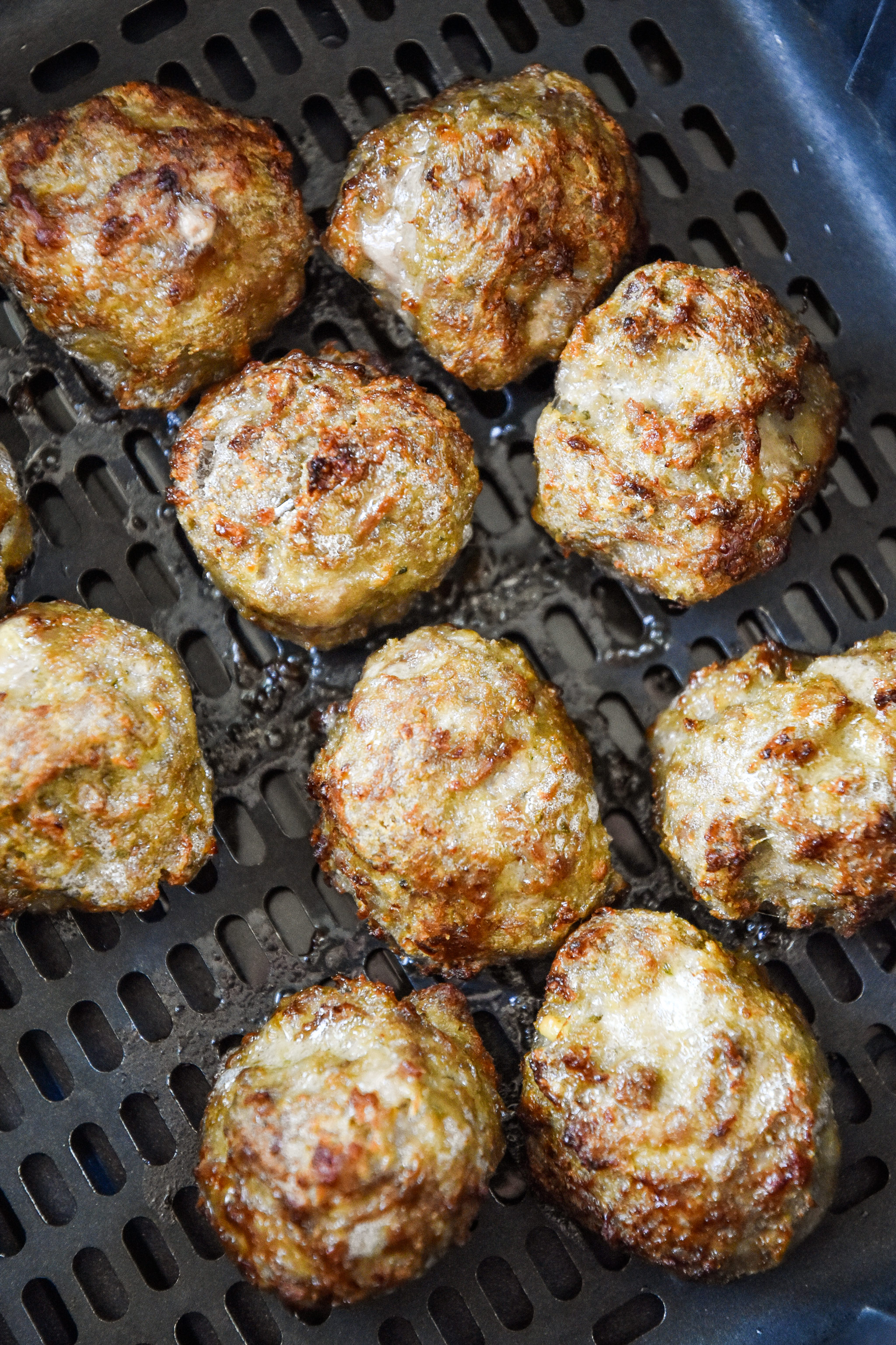 meatballs freshly cooked in an air fryer.