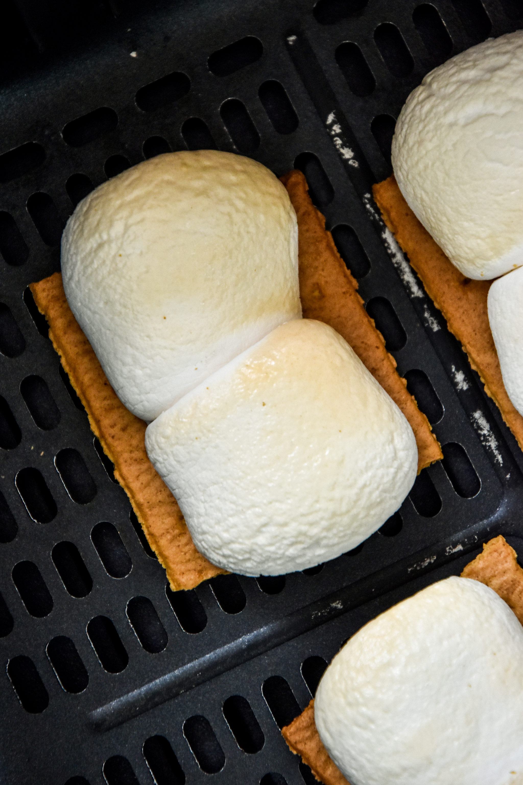 close up of a brown marshmallow cooked in the air fryer.