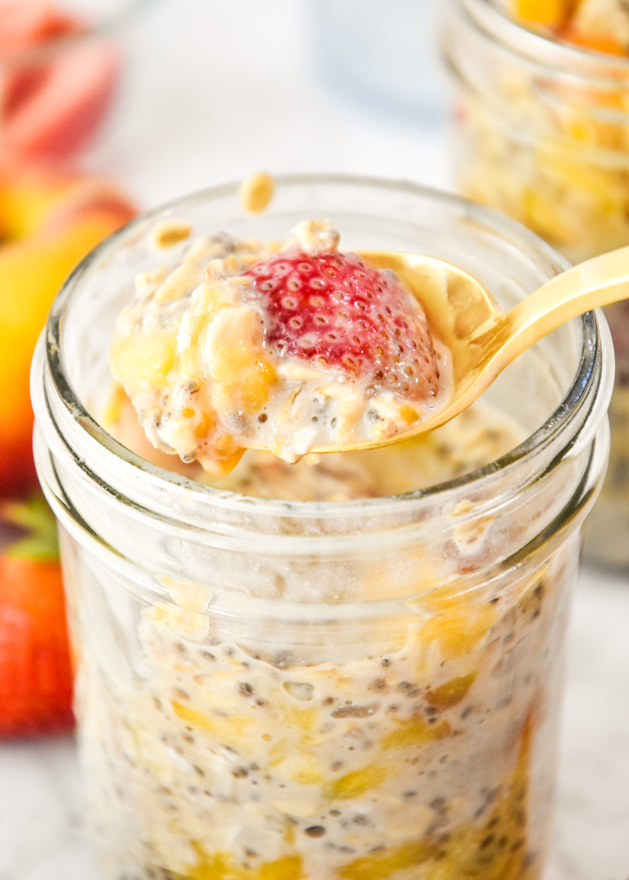 spoonful of strawberry peach overnight oats.