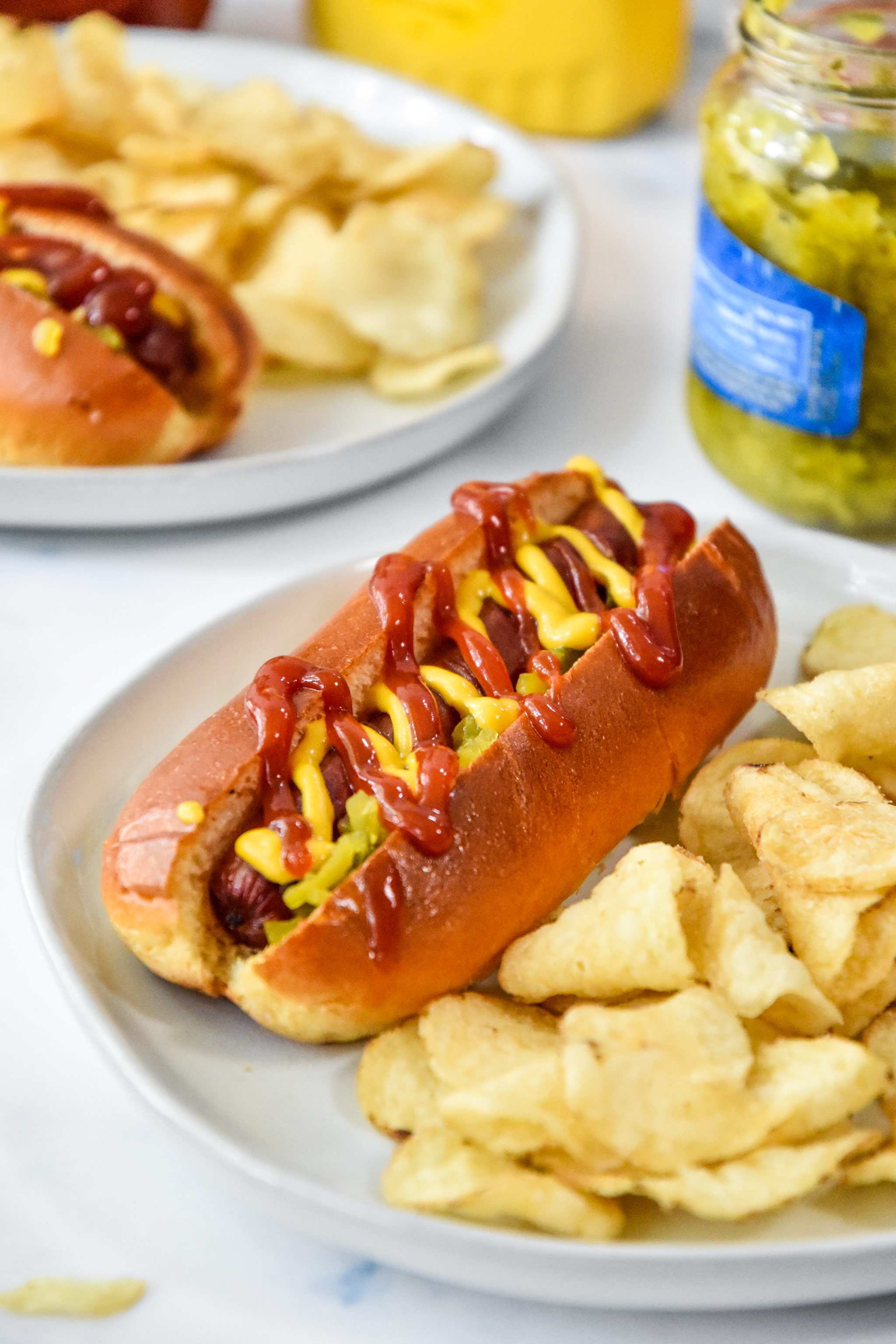 air fryer hot dogs served with chips.