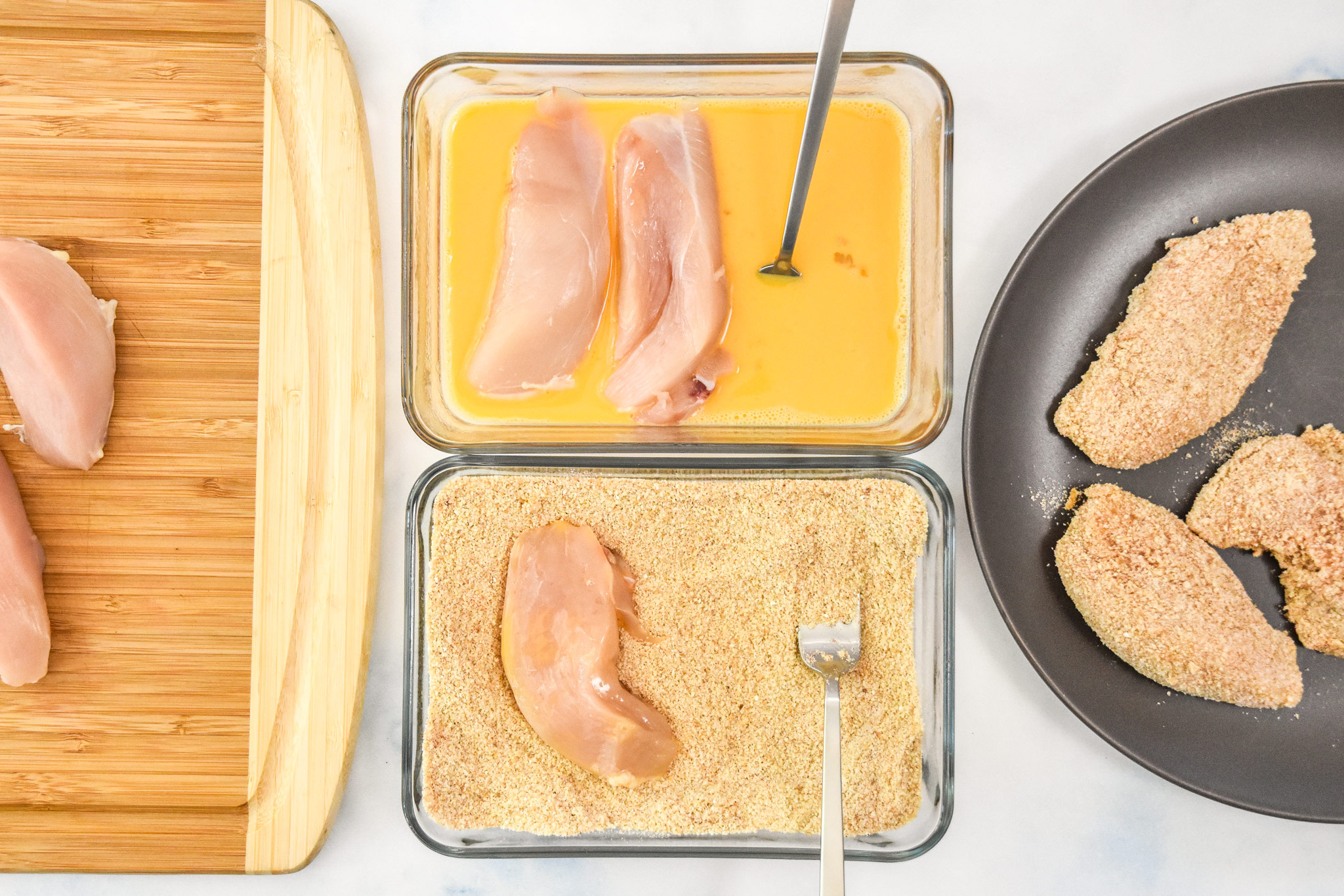 the breading station with an egg bowl and a bread crumb mixture bowl.