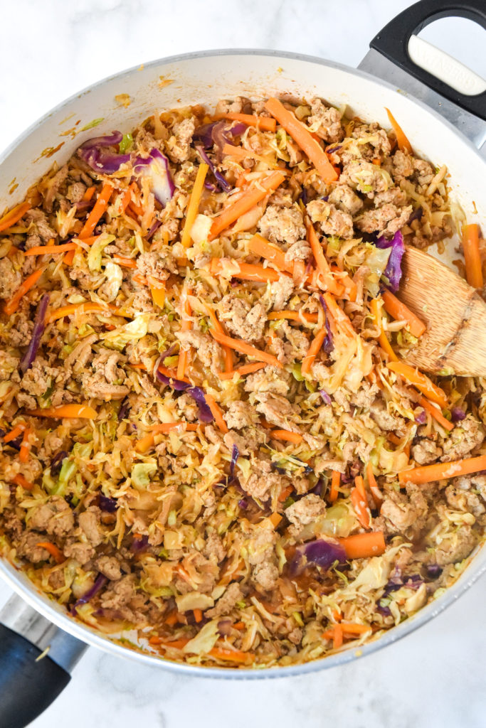 skillet of freshly cooked spicy ground turkey cabbage meal prep.
