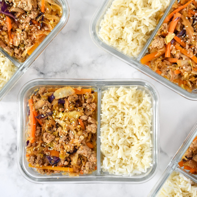 spicy ground turkey cabbage stir fry meal prep in a glass meal prep container.