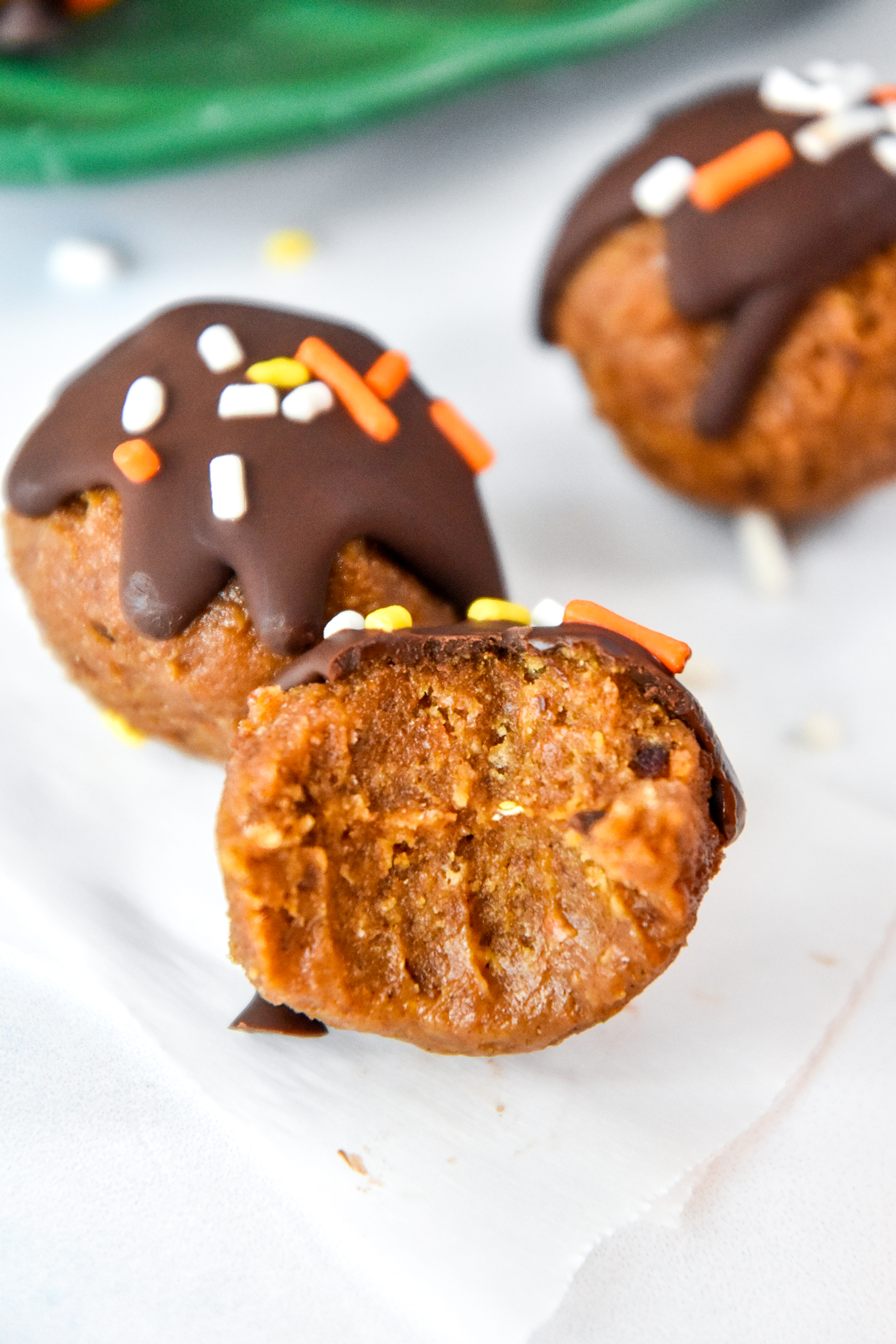 bite out of a no bake pumpkin spice lined date ball.