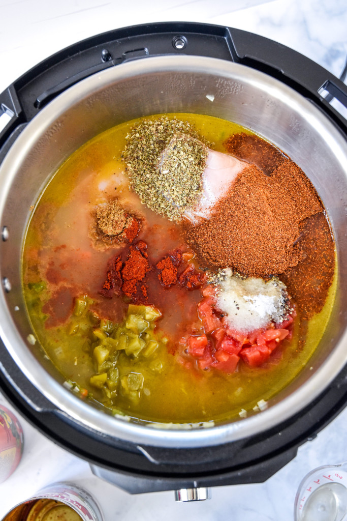 all ingredients in the instant pot before cooking the no bean chicken chili.