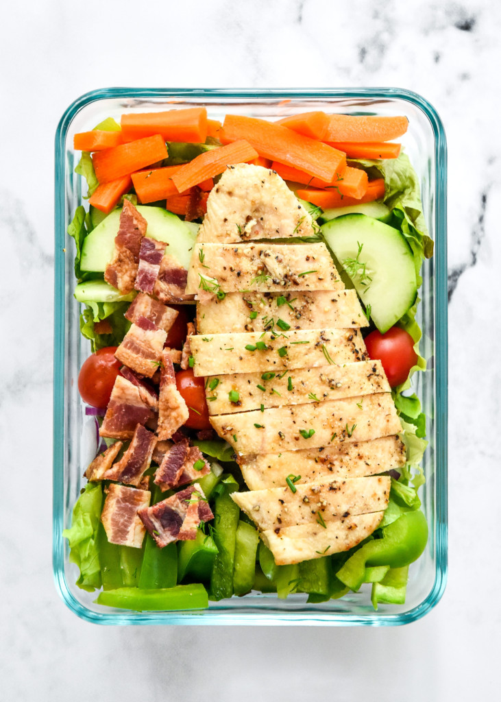 meal prepped go-to chicken bacon ranch salad in a glass container no dressing.