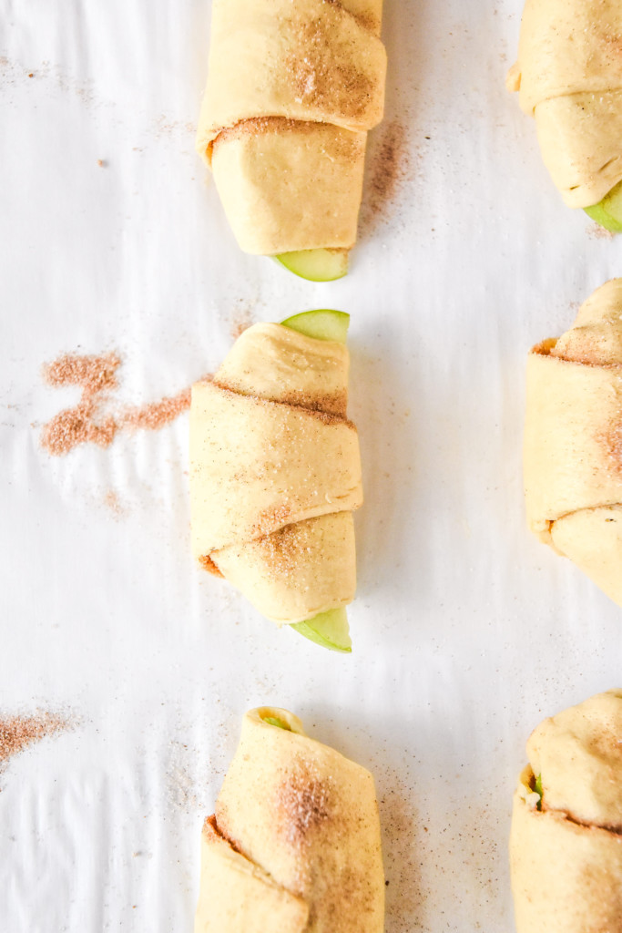 rolled up apple pie crescent rolls before air frying.