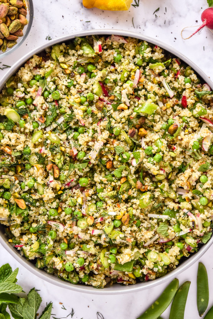 finished and served bowl of spring vegetable quinoa salad with fresh herbs.
