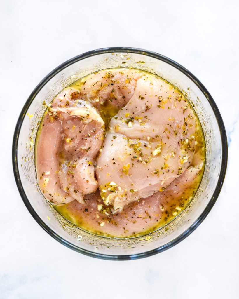 chicken breasts in a greek marinade with lemon and olive oil.