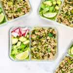 thai chicken larb inspired meal prep in a glass container with veggies.