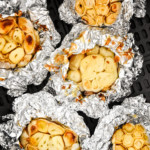 heads of garlic wrapped in foil and roasted in an air fryer.