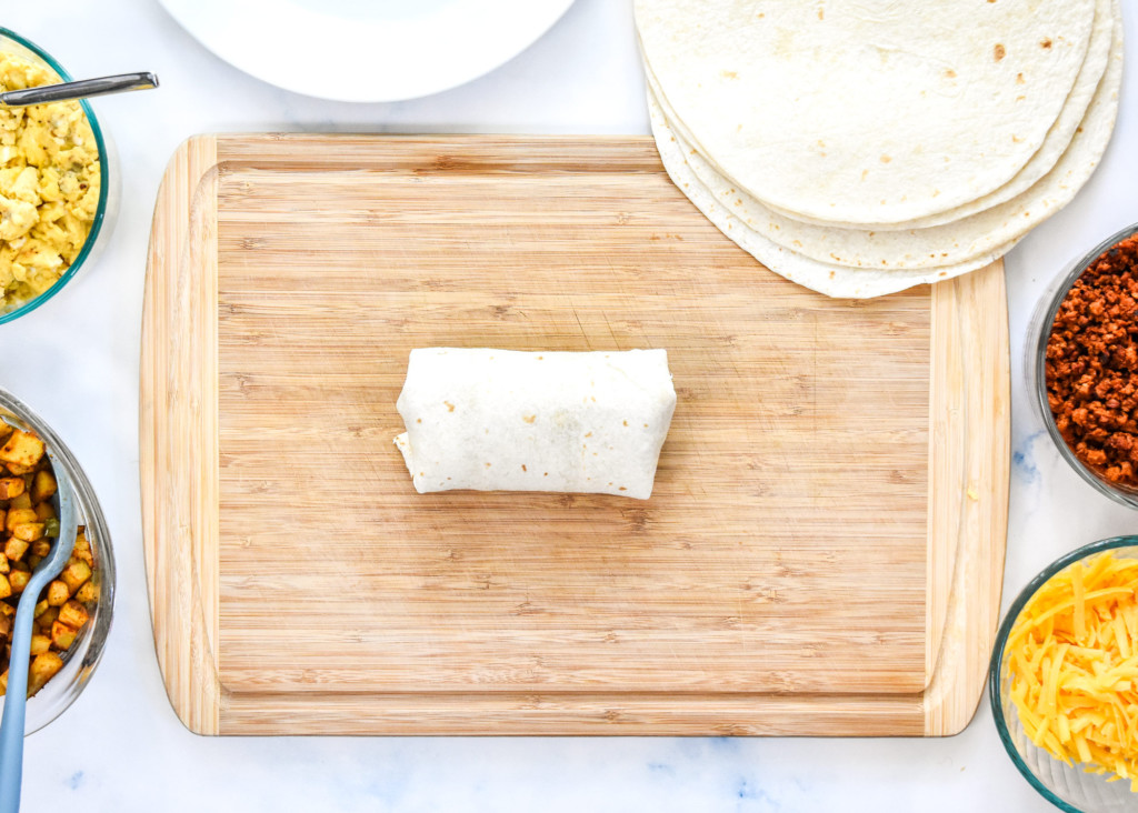 a folded wrapped meal prep soy chorizo breakfast burrito.
