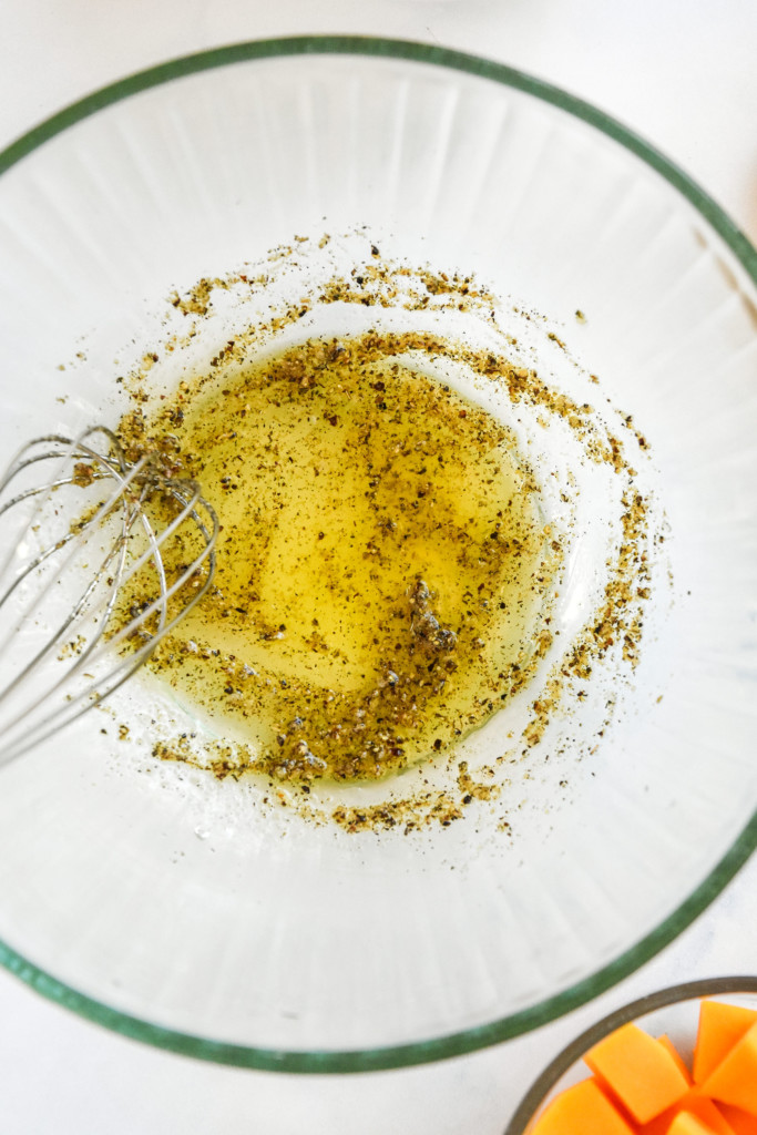seasoning with oil and vinegar before mixing with the raw vegetables.