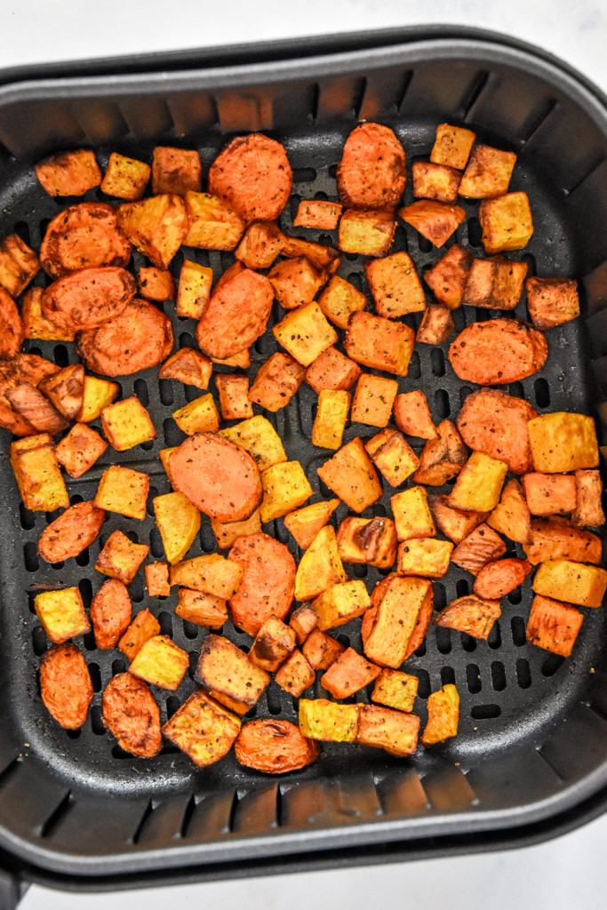 air fryer roasted fall vegetables cooked in the air fryer basket.