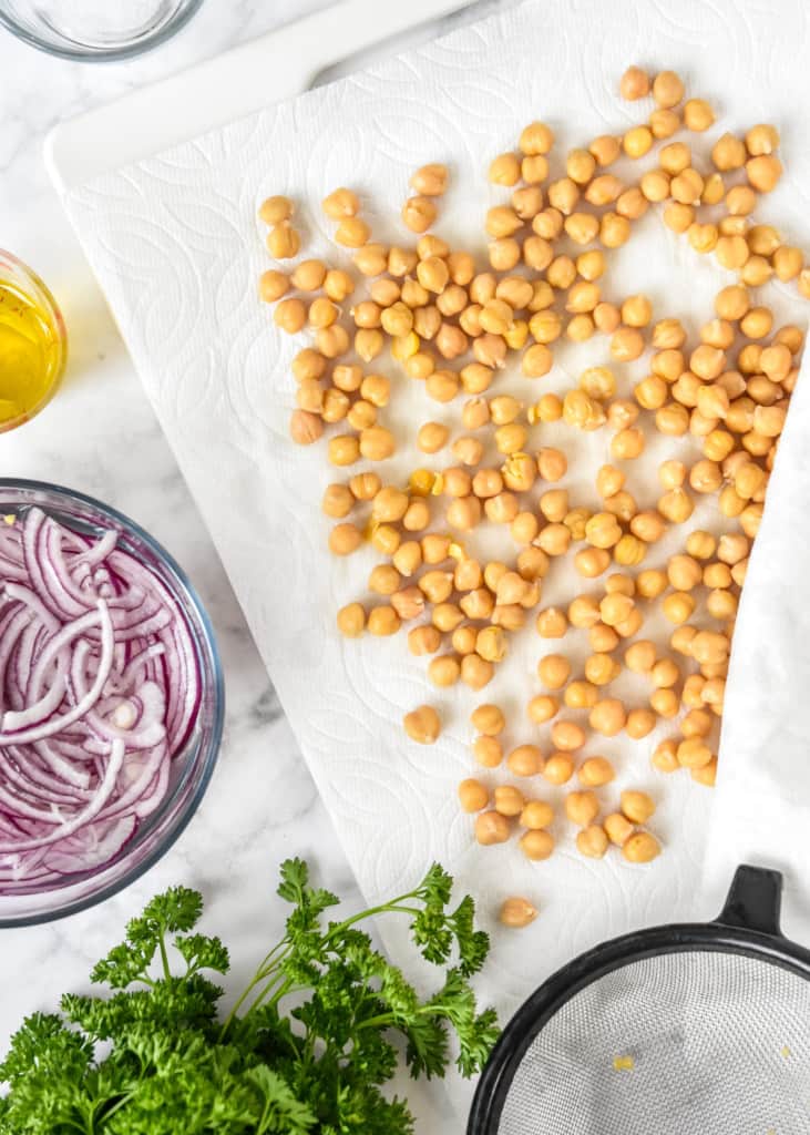 drying chickpeas between paper towels before adding them to the salad.