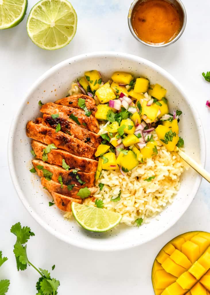 chipotle lime chicken meal prep in a bowl with a lime wedge.