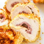 air fryer chicken cordon bleu sliced into pieces with melting cheese coming out.