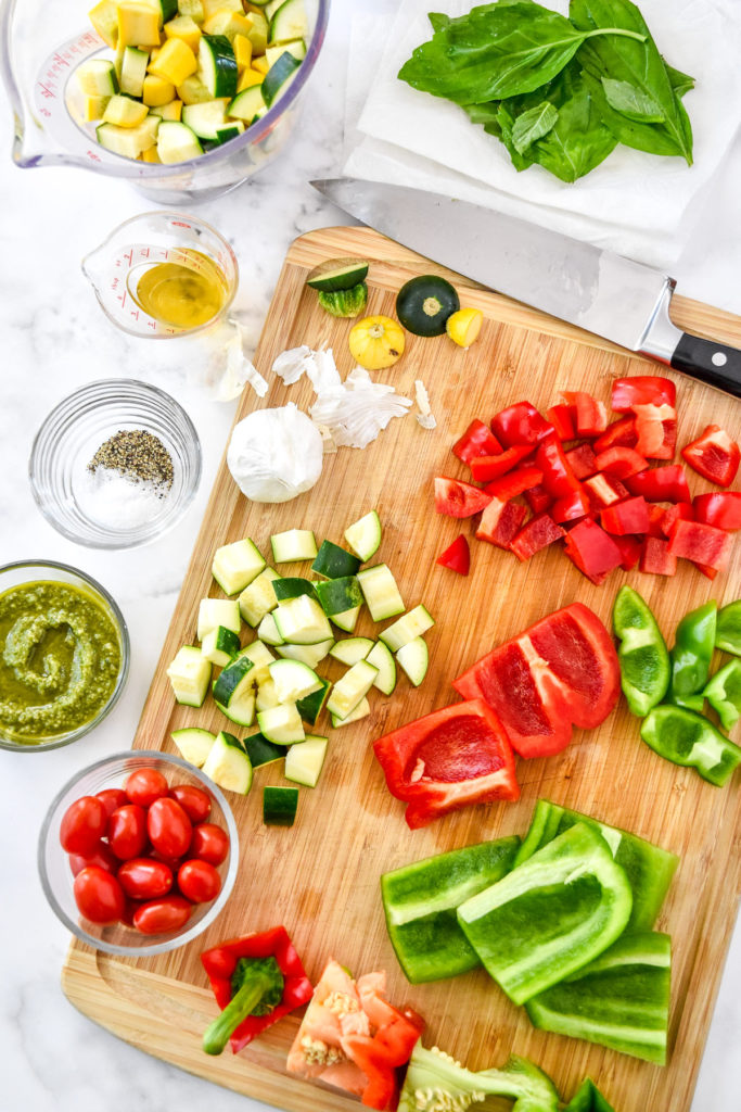 cutting and preparing vegetables on a cutting board.