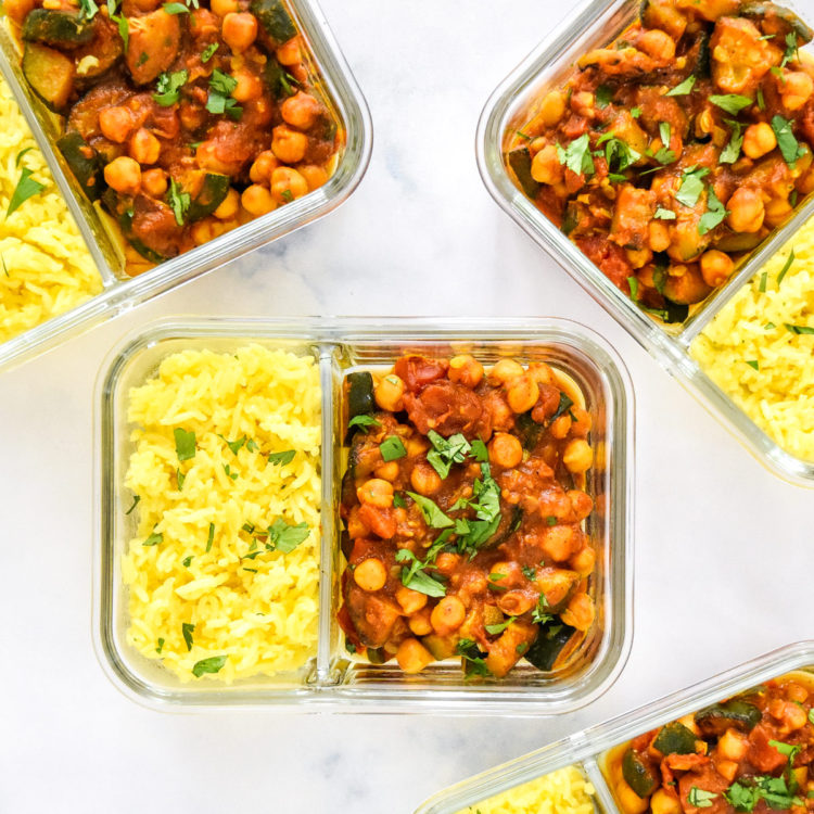 zucchini chickpea curry meal prep recipe with cilantro in glass meal prep containers.