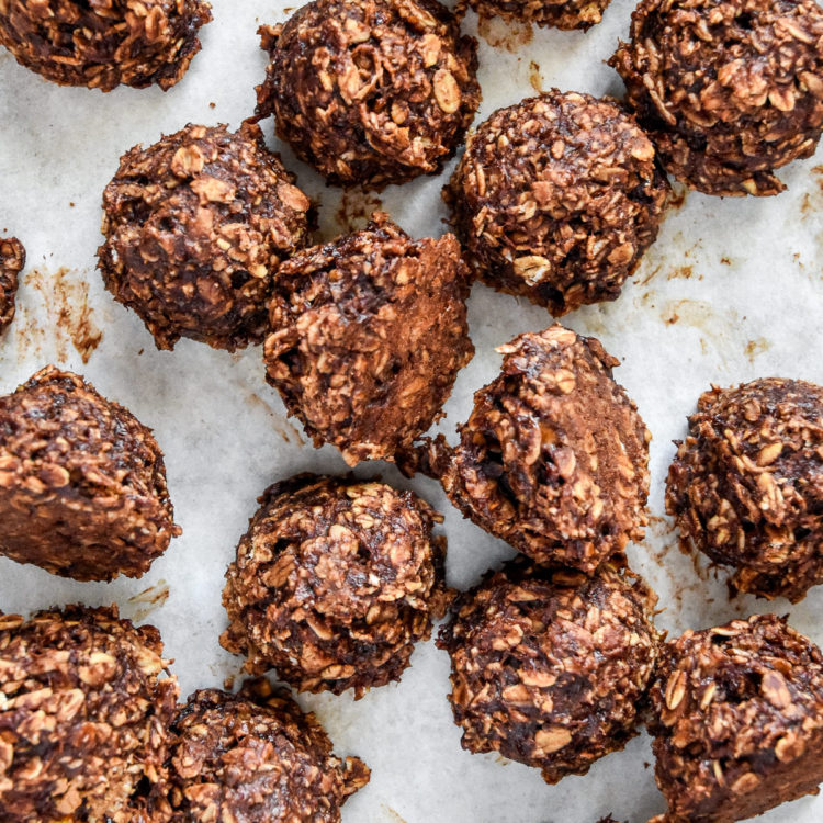 banana chocolate oatmeal cookie mounds on parchment paper.