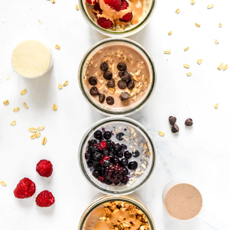 overnight oats with various toppings in glass mason jars.