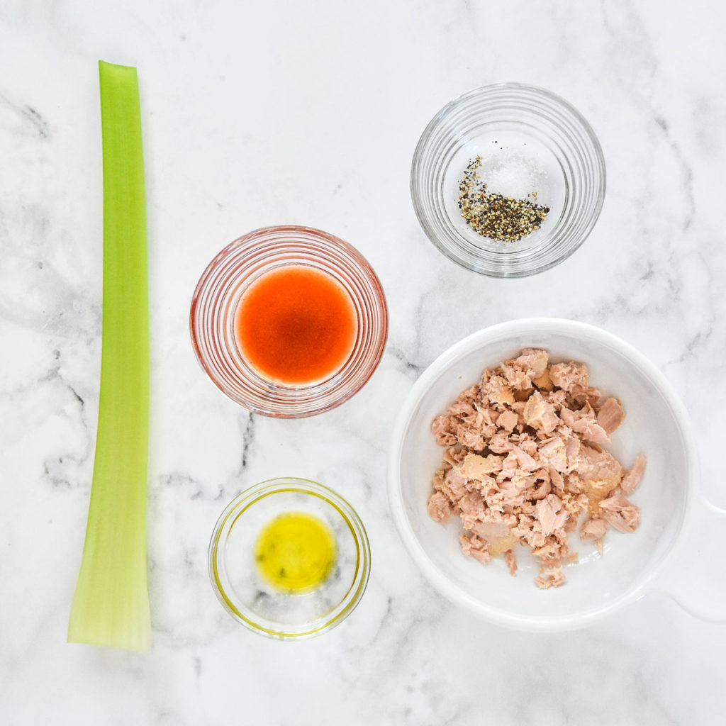 ingredients needs to make buffalo flavored tuna including a stalk of celery and buffalo sauce.