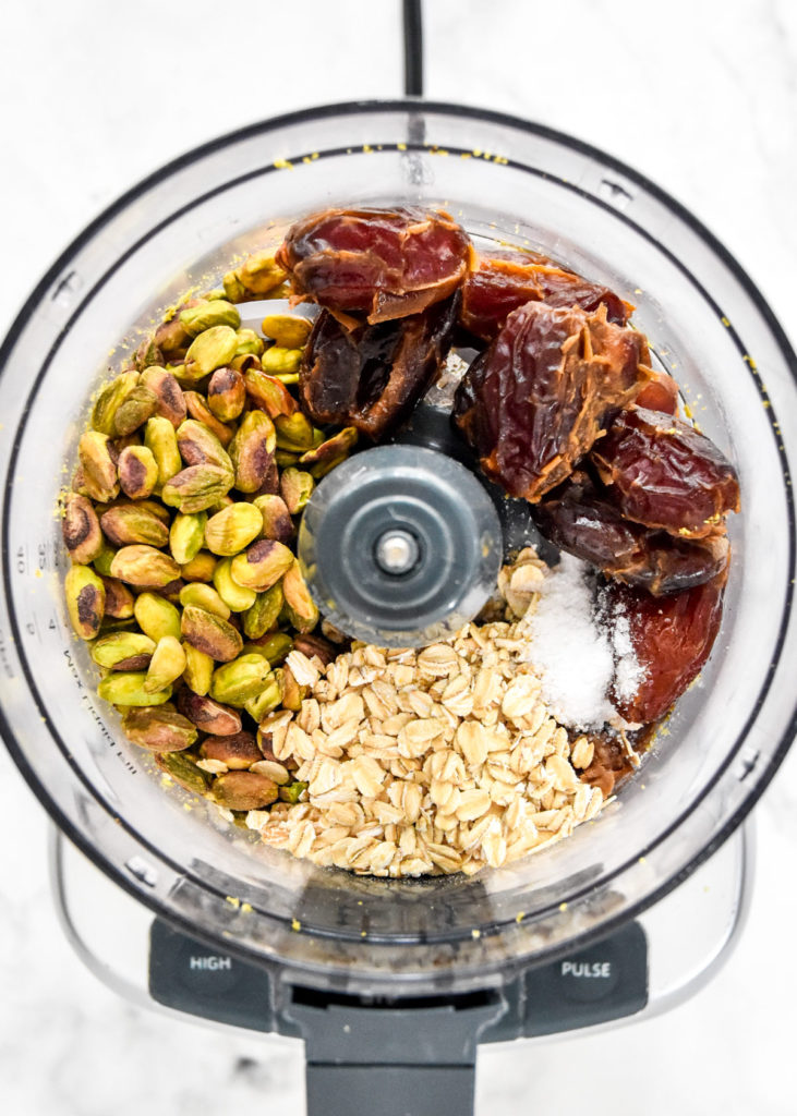 ingredients for the energy balls in the food processor bowl before blending up.