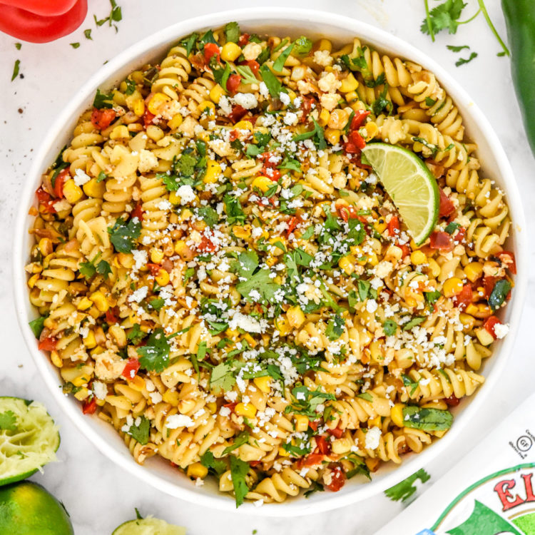 pan roasted corn pasta salad with lime in a serving bowl.