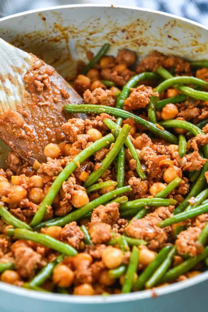 Korean-Inspired Gochujang Meat And Beans in a large skillet.