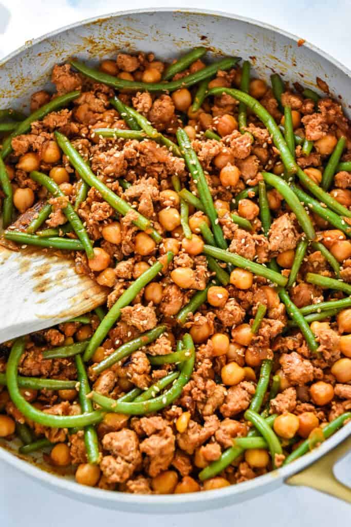 Korean-Inspired Gochujang Meat And Beans in a large skillet.