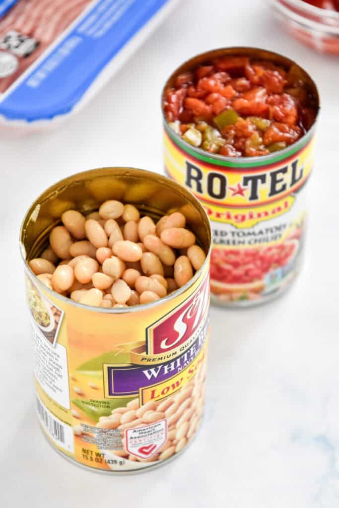 opened cans of white navy beans and rotel.