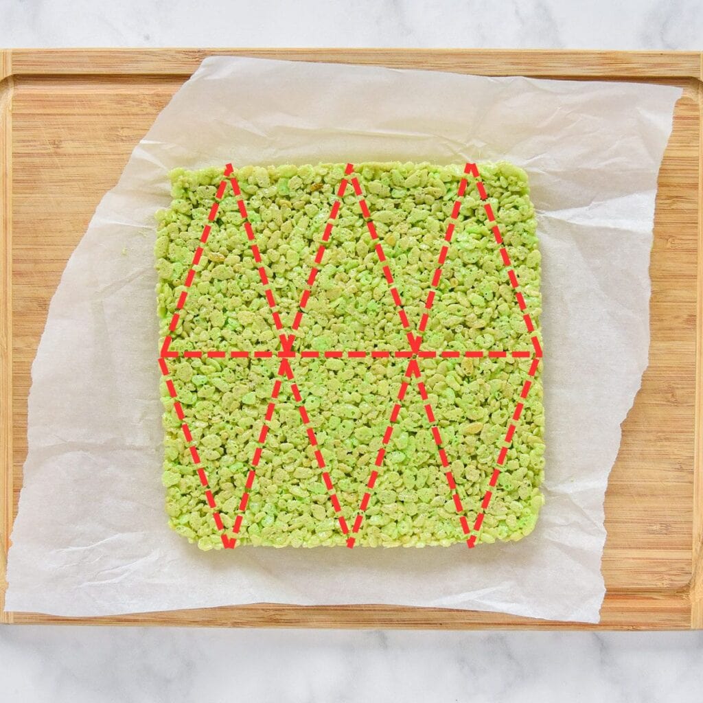 diagram of how to cut rice krispies treats into triangles for christmas trees.