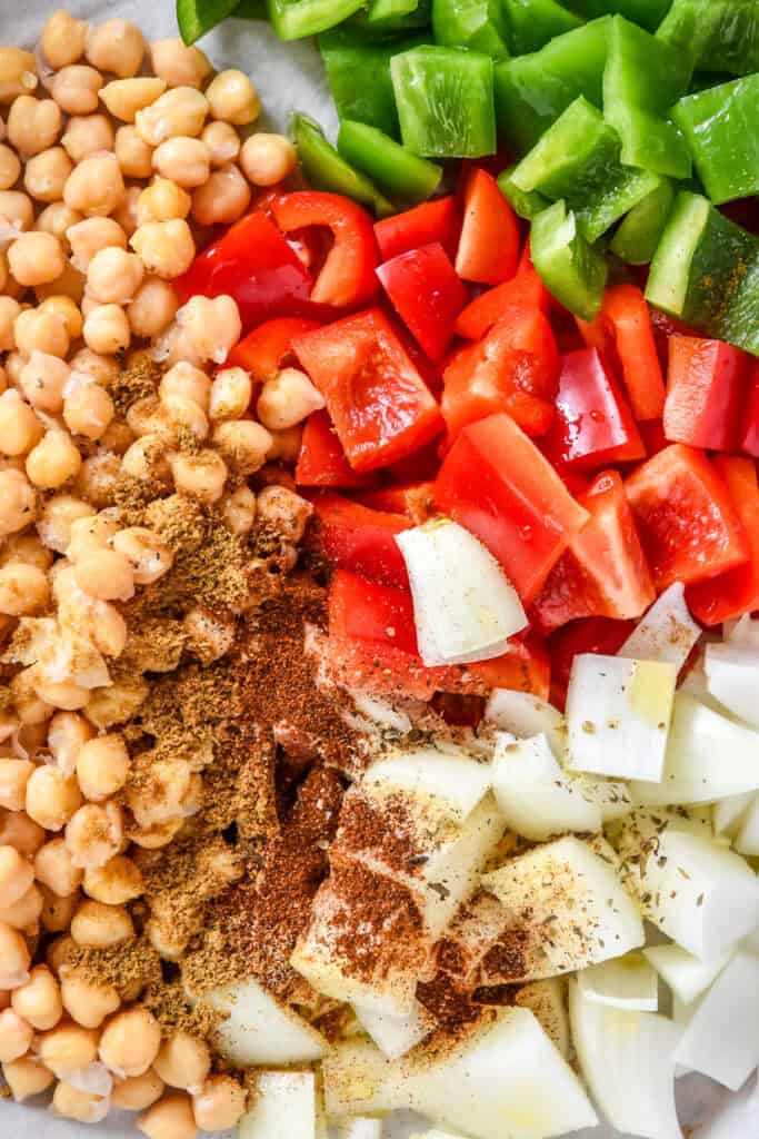 seasonings on the raw veggies and chickpeas before stirring.