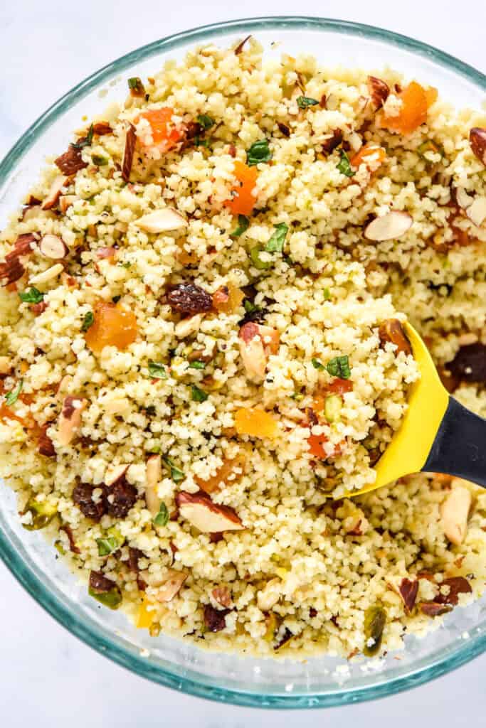 dried fruit and nut couscous mixture in a glass bowl.